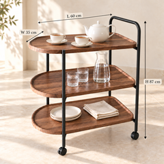 عربة تقديم بثلاثة رفوف بمظهر خشبي وهيكل أسود ومقبض وعجلات، 60 × 35 × 87 سم | Three-tier wood-look serving trolley with black frame, handle, and wheels, 60 × 35 × 87 cm