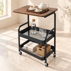 عربة تقديم بثلاثة مستويات وسطح بمظهر خشبي ورفوف سوداء وعجلات | Three-tier serving trolley with a wood-look top, black shelves, and wheels